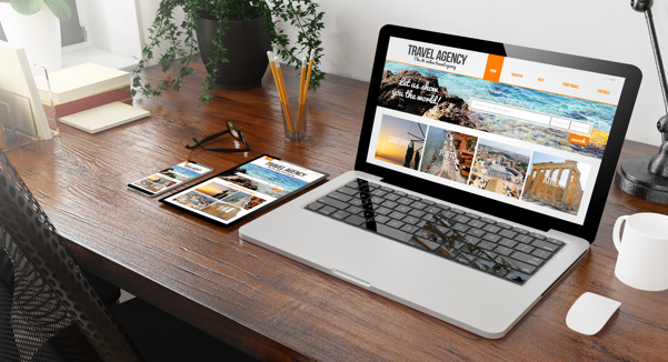 image of laptop with travel agency site open